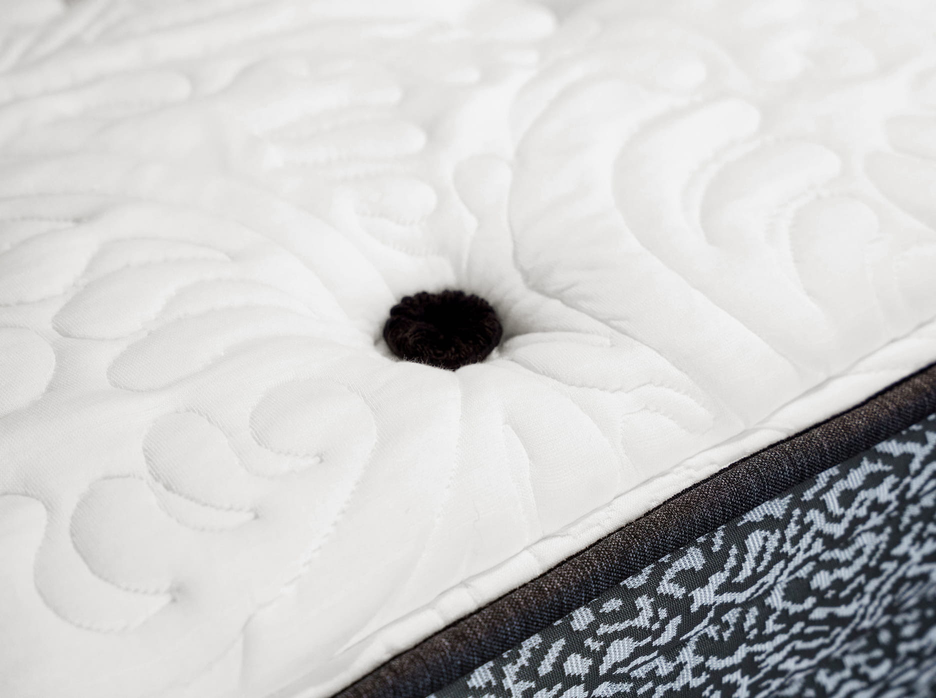 Close up of Posh hand tufted mattress